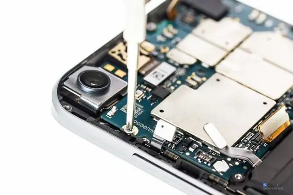 Remove the screws securing the motherboard
