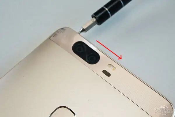 Heat the cover on the top of the phone with a heat gun