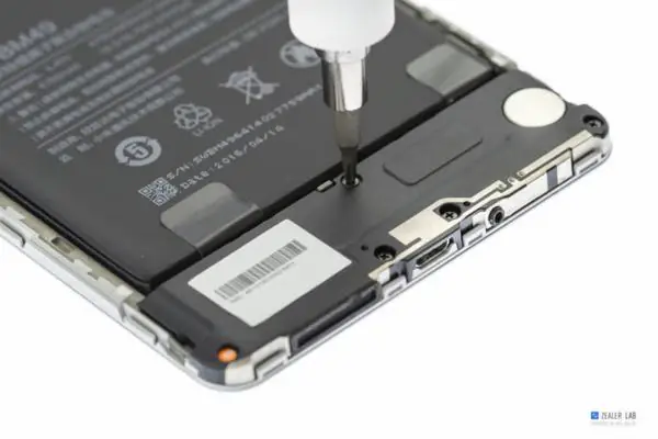 Remove the five screws securing the speaker module