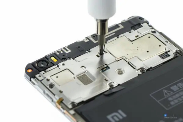 Remove all screws securing the metal bracket