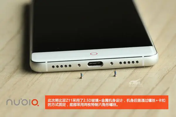 Remove the two screws beside the USB Type-C port