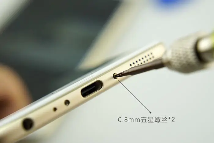 Remove the two screws near the USB Type-C port