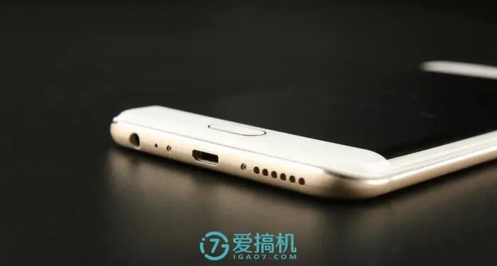 Remove the two screws beside the Micro USB port