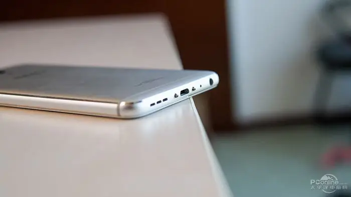 Remove the two screws beside the Micro USB port