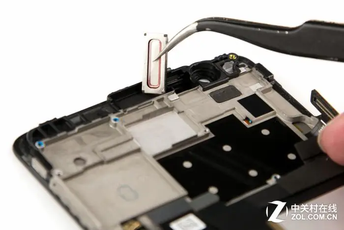 Use tweezers to remove the earpiece