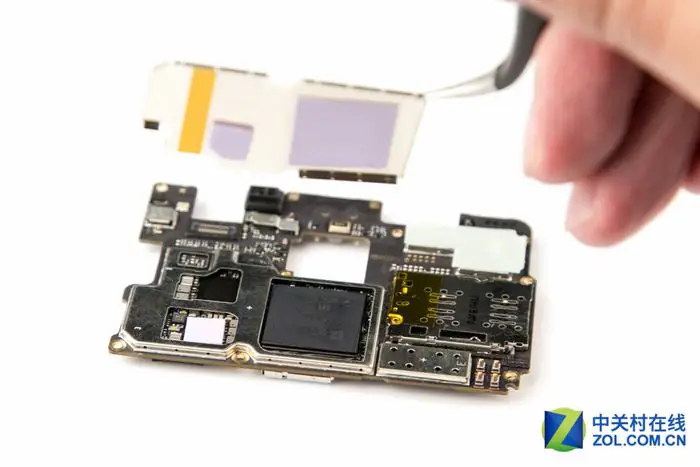 Remove the metal shield from the motherboard
