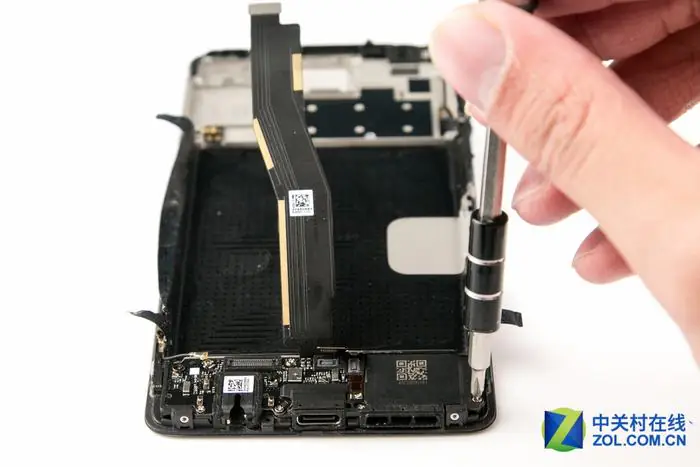 Remove all screws securing the sub-board