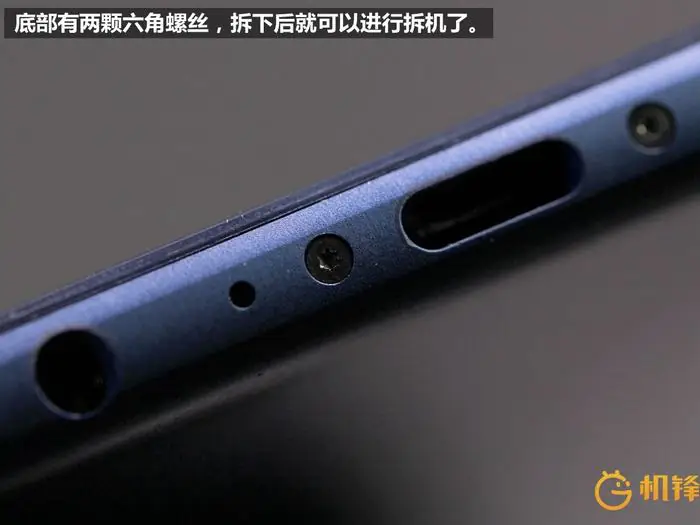 Remove the two screws beside the USB Type-C port