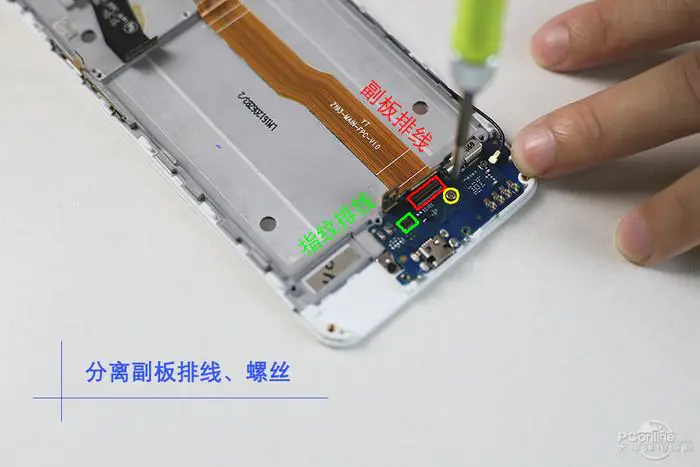 Remove the screw securing the sub-board