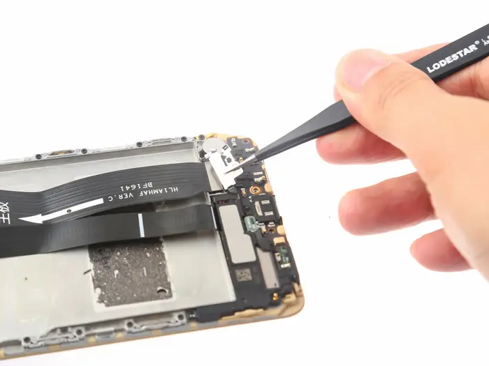 Remove the metal plate that secures the main FPC