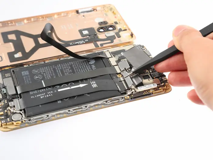 Remove the metal plate using tweezers