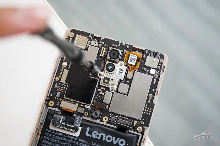 Remove the three screws securing the camera bracket