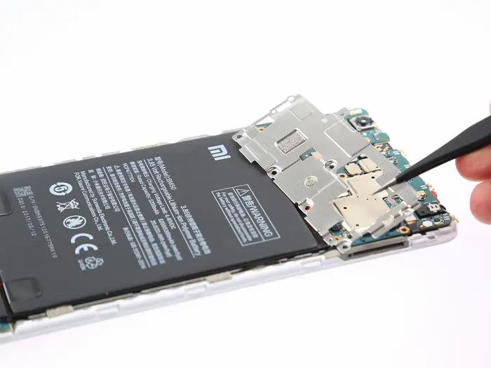 Remove the metal plate with tweezers