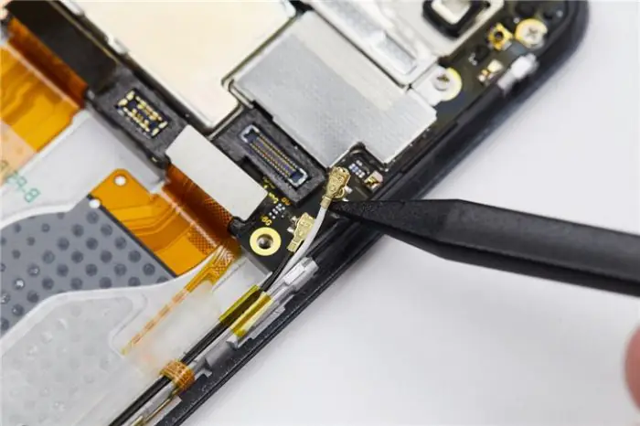 Disconnect the two coaxial cables.